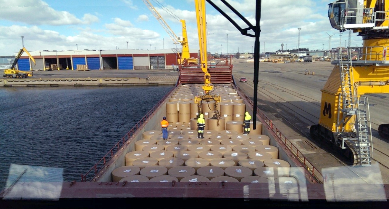Paper rolls staged on dock at Hamina port, Finland, ready for loading